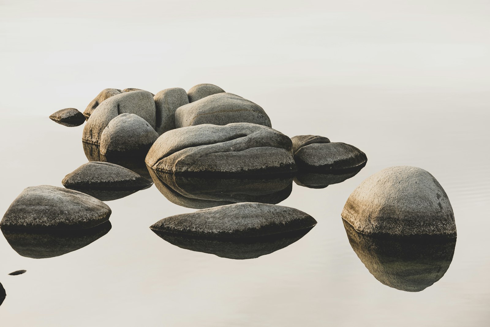 Smooth stones resting in still water